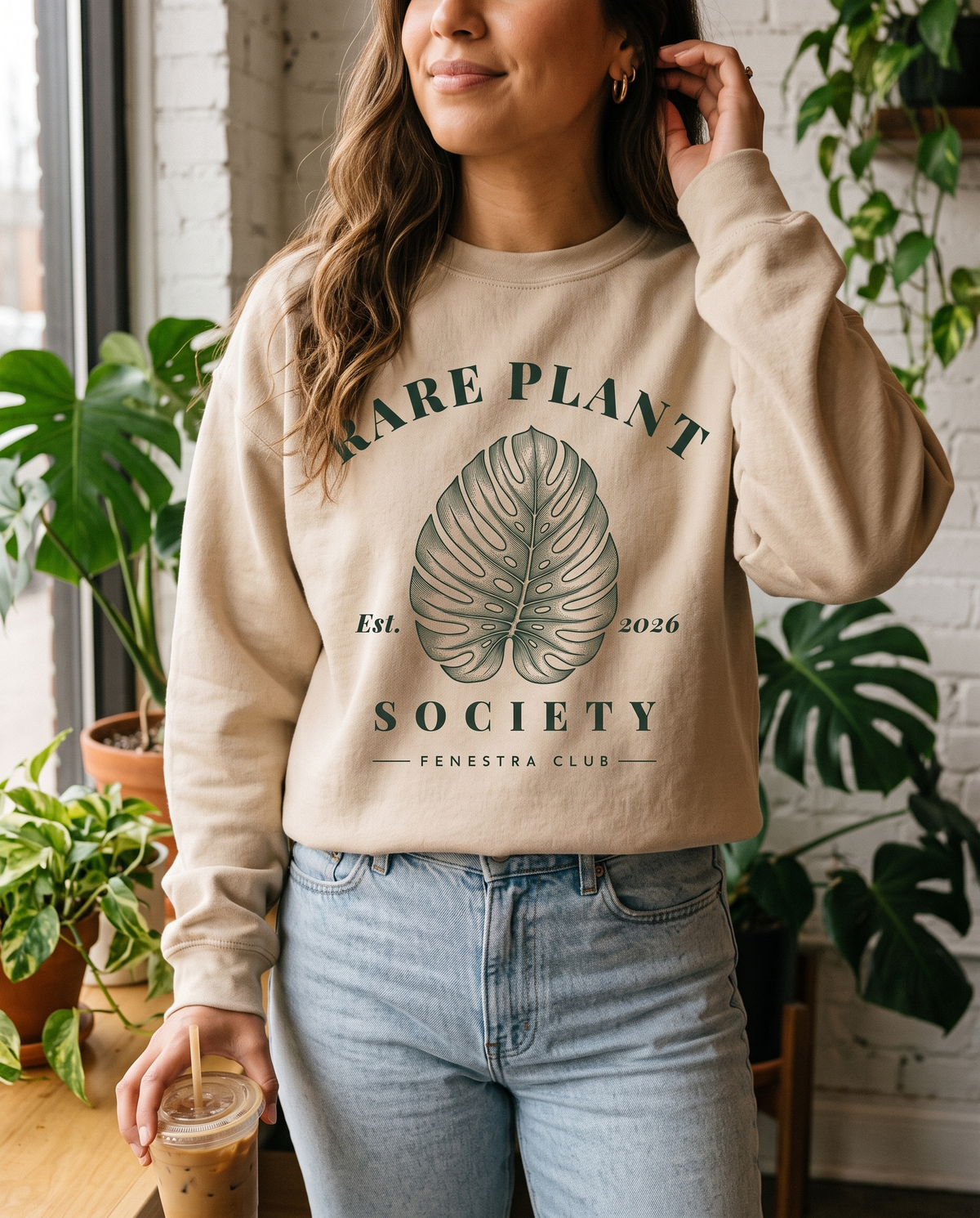 Woman wearing the Rare Plant Society crewneck sweatshirt in Sand