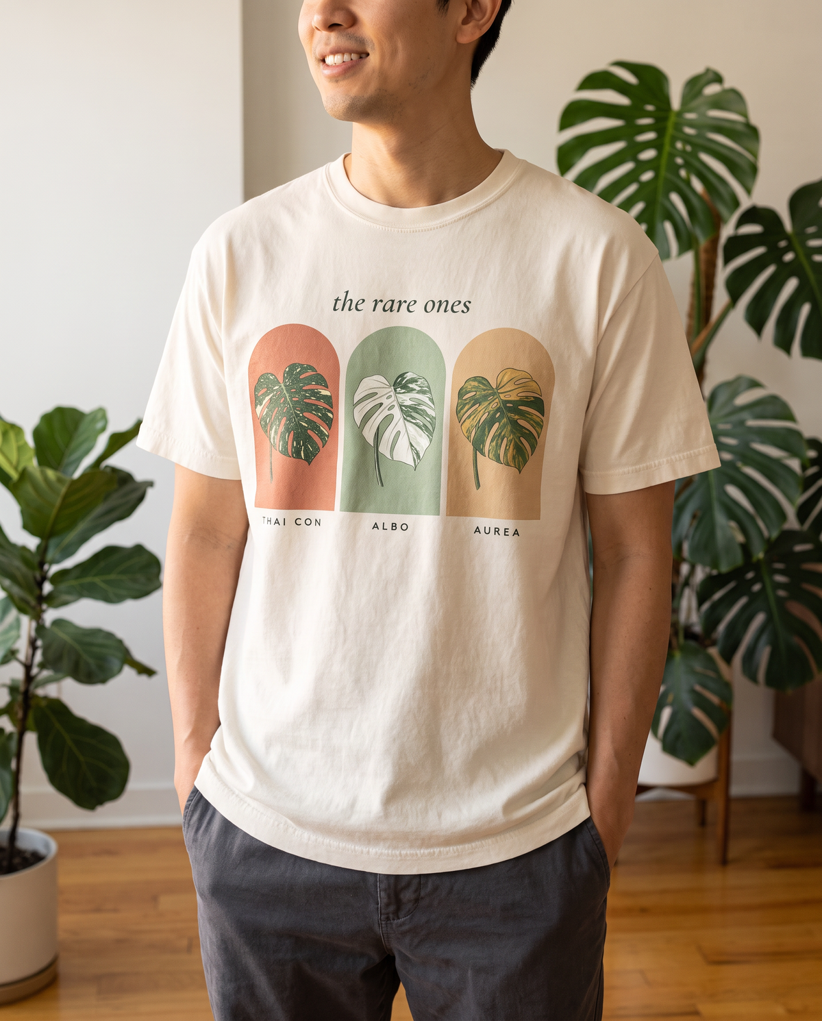 Man wearing The Rare Ones variegated monstera tee in Ivory