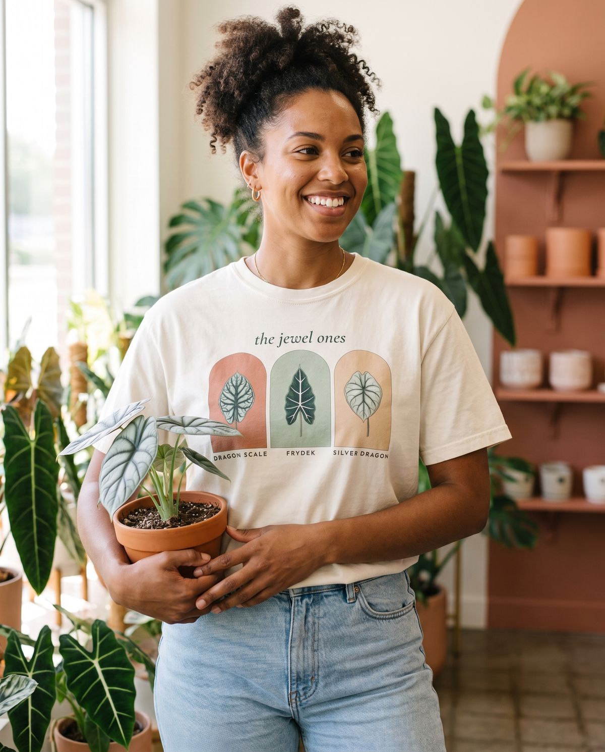 Woman wearing The Jewel Ones alocasia tee in Ivory