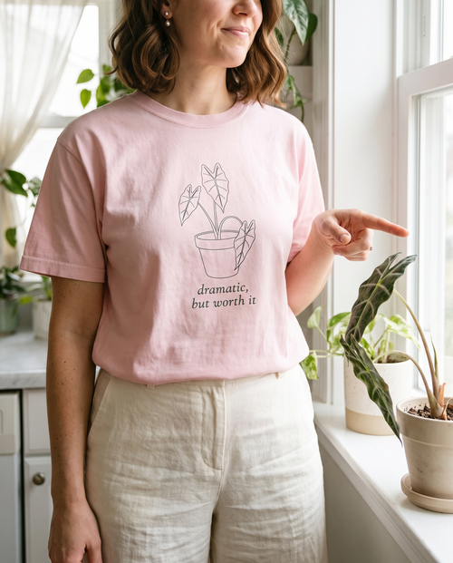 Woman wearing the Dramatic, But Worth It alocasia tee in Blossom